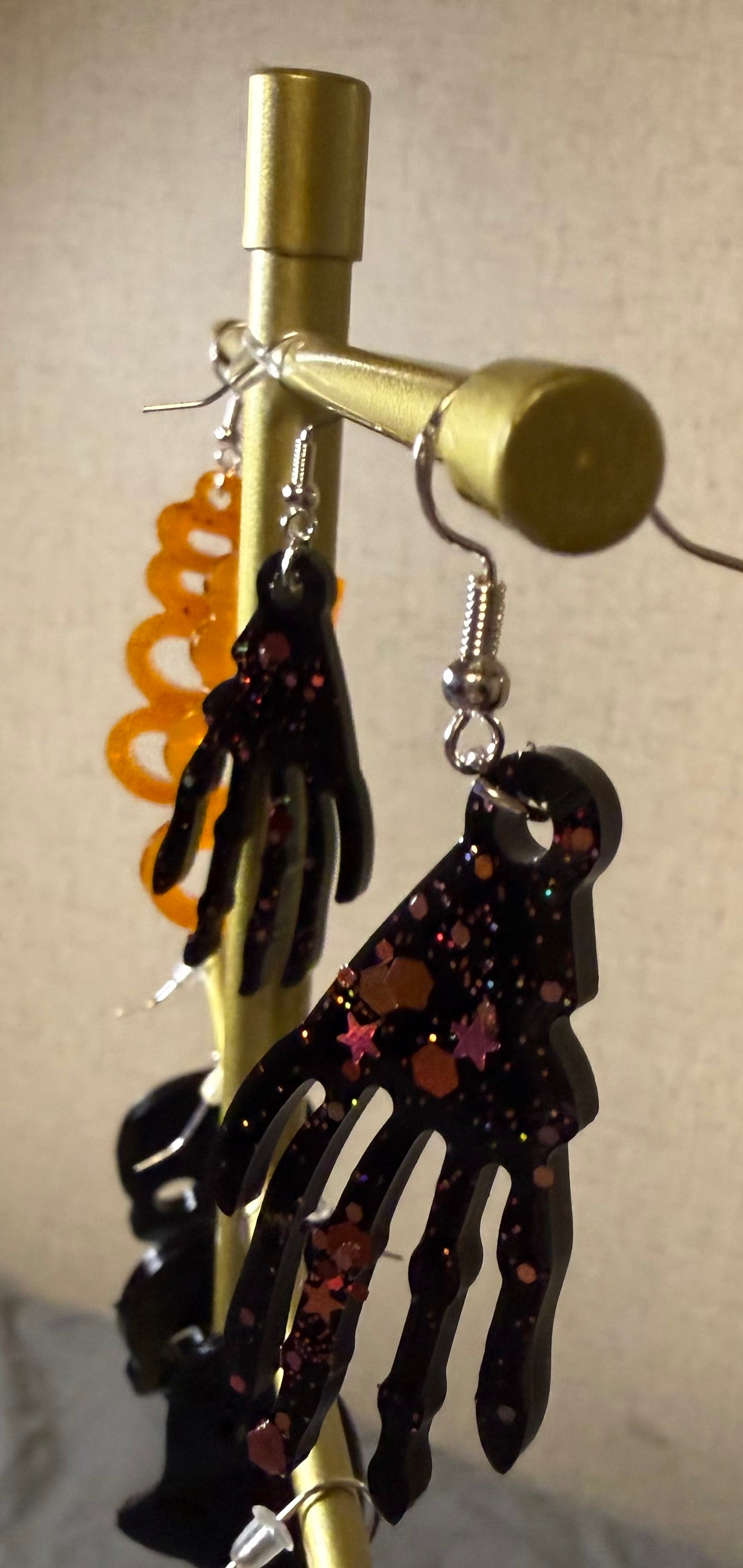 Black skeleton hand earrings W/glitter