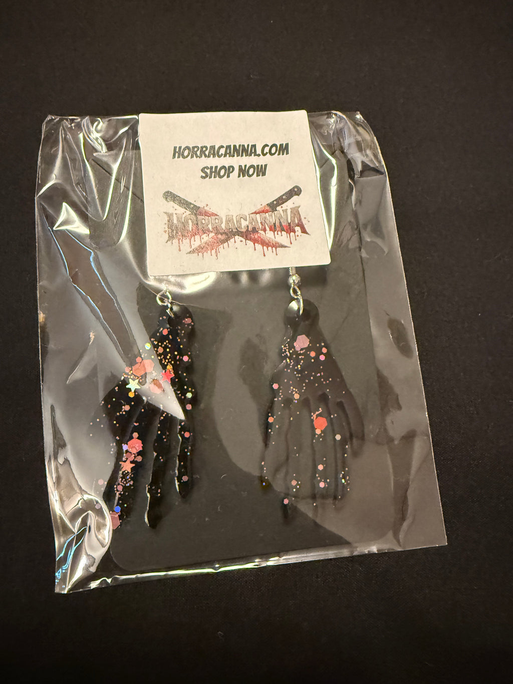 Black skeleton hand earrings W/glitter